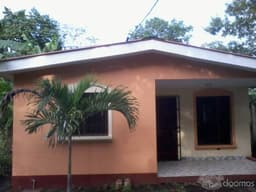 VENDO CASA CON TERRENO NEGOCIABLE  EN CARRET. TICUANTEPE